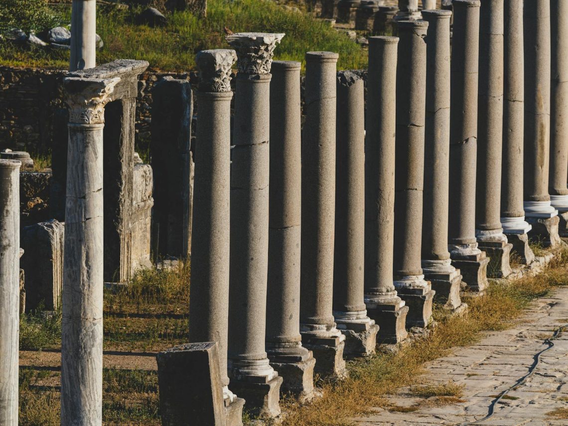 Historical Roman columns in Perge, Turkey during a sunny summer day.