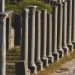 Historical Roman columns in Perge, Turkey during a sunny summer day.