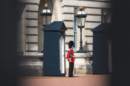 A classic view of a royal guard in uniform outside Buckingham Palace, London.