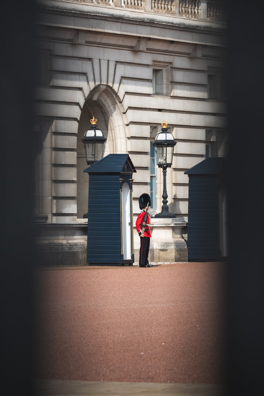 A classic view of a royal guard in uniform outside Buckingham Palace, London.