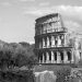 Black and white photo of the Colosseum in Rome, capturing its historic architecture.