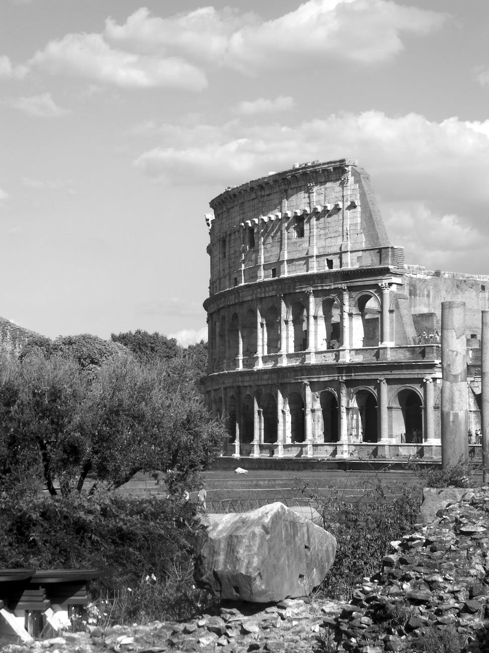 Black and white photo of the Colosseum in Rome, capturing its historic architecture.