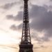 Stunning view of the Eiffel Tower silhouetted against a vibrant sunset sky in Paris, France.