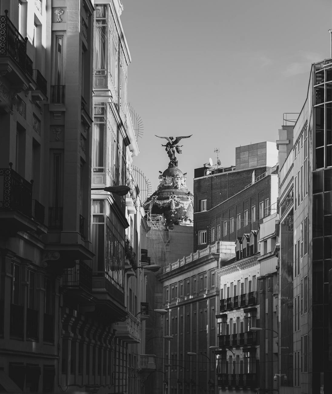 A dramatic black and white image of iconic architecture on Madrid's skyline showcasing urban European charm.