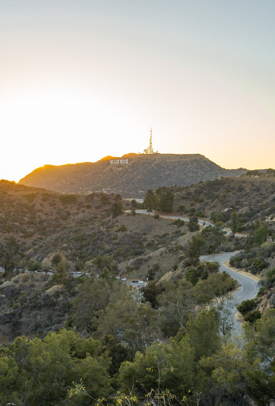 Captivating sunset over the iconic Hollywood Sign and rugged hills of Los Angeles.