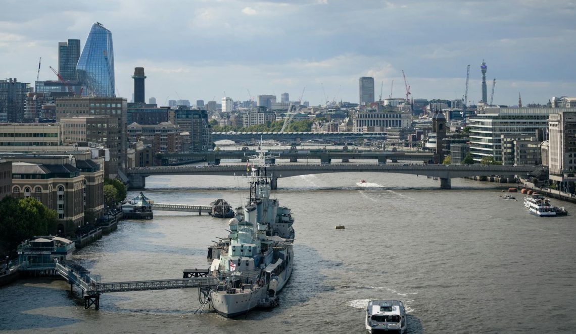 A breathtaking view of the River Thames in London featuring historic bridges and modern skyline.