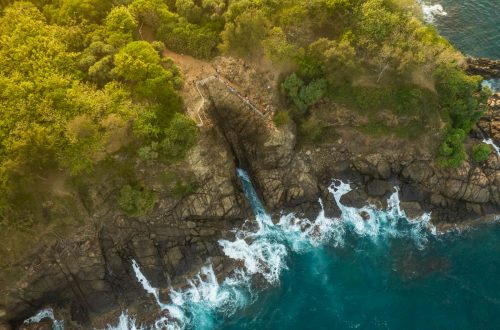 Breathtaking aerial view of Thangalla's rocky coastline and lush greenery.