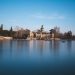 Scenic view of the lake and monument at El Retiro Park during twilight in Madrid, Spain.