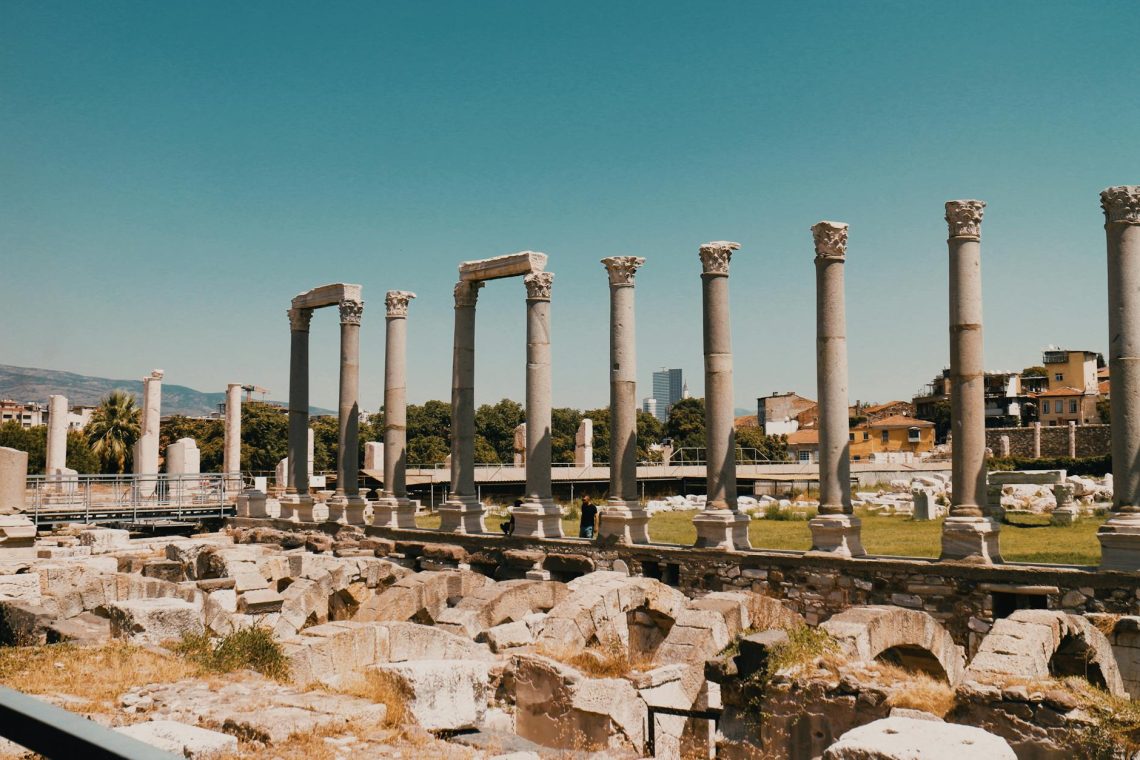 Ancient Roman columns under a clear blue sky at Izmir Agora Open Air Museum, Turkey.