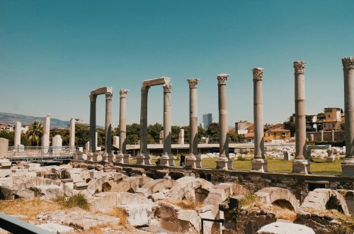 Ancient Roman columns under a clear blue sky at Izmir Agora Open Air Museum, Turkey.
