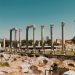 Ancient Roman columns under a clear blue sky at Izmir Agora Open Air Museum, Turkey.