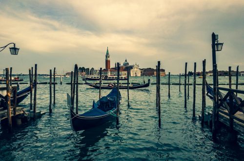 Beautiful view of gondolas on Venice's canals with San Giorgio Maggiore in the background.