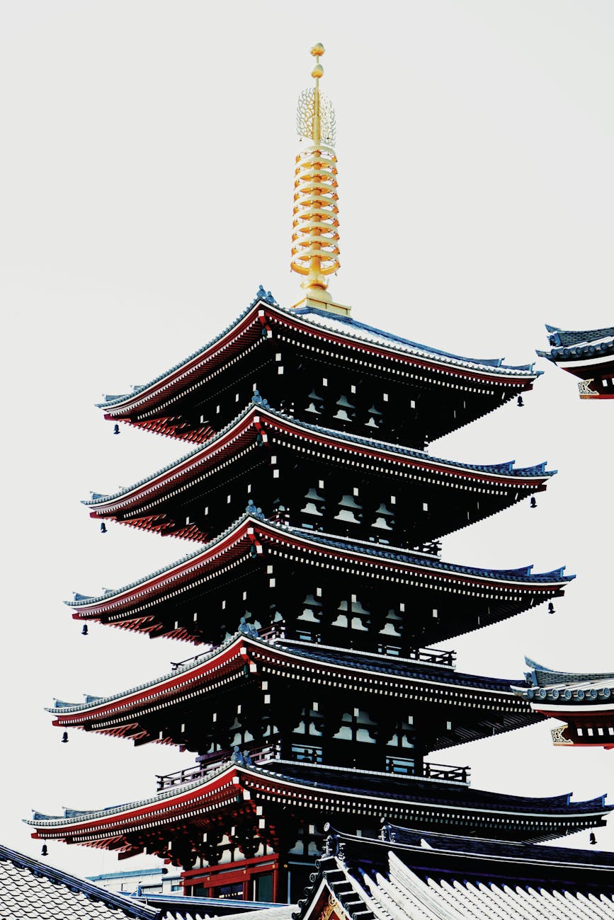 Vertical view of the Senso-ji Temple pagoda, a prominent Tokyo landmark, during the day.