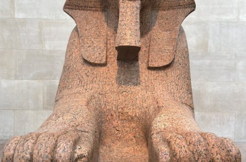 Granite Sphinx statue showcasing ancient Egyptian art in museum.