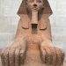Granite Sphinx statue showcasing ancient Egyptian art in museum.