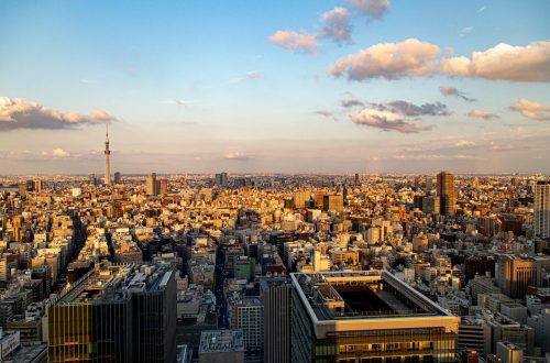 Aerial view of Tokyo cityscape with Tokyo Skytree tower during sunset.