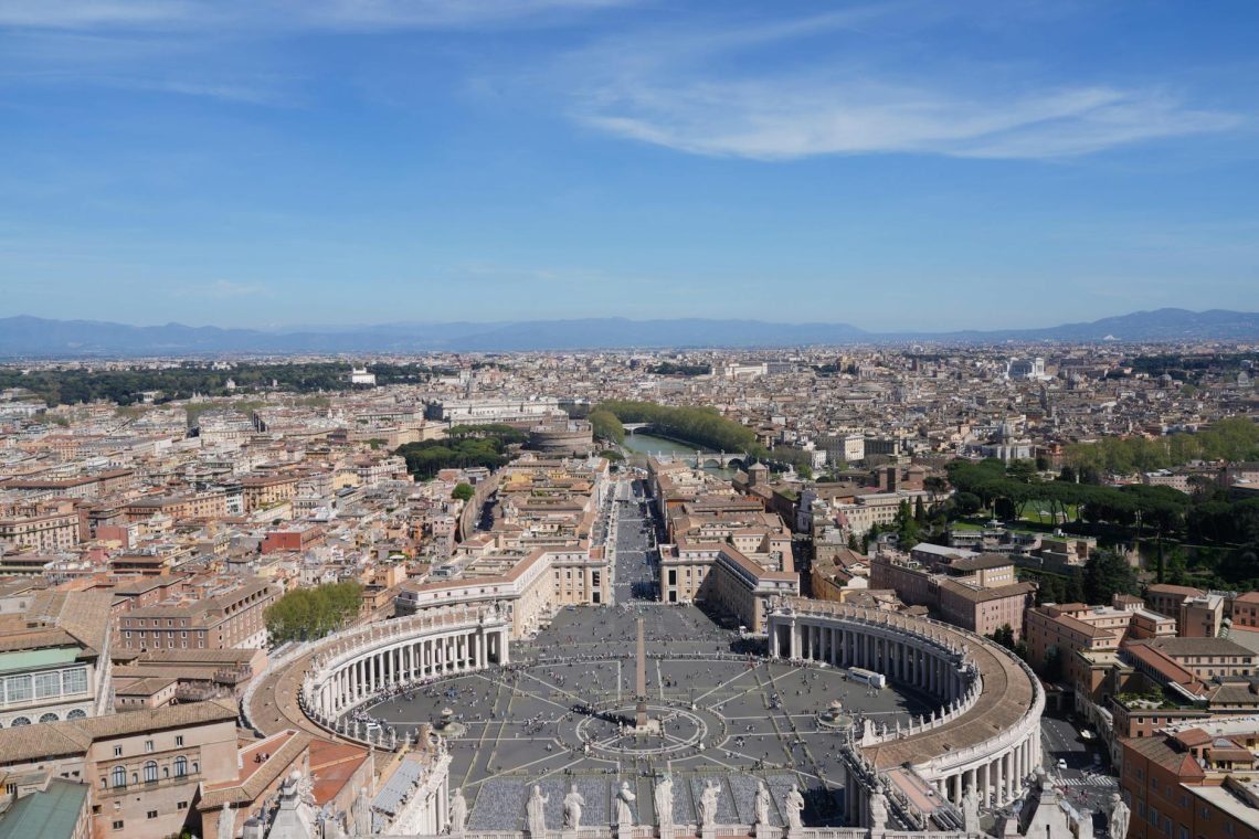 A breathtaking aerial view of St. Peter's Square in Vatican City, highlighting the iconic architecture and urban landscape.