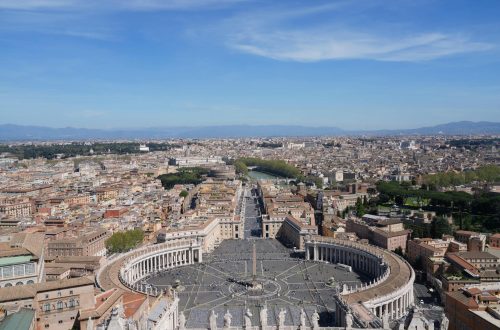 A breathtaking aerial view of St. Peter's Square in Vatican City, highlighting the iconic architecture and urban landscape.